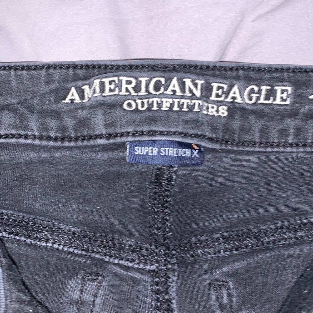 Black American eagle outfitters heavy distressed jegging size 4P